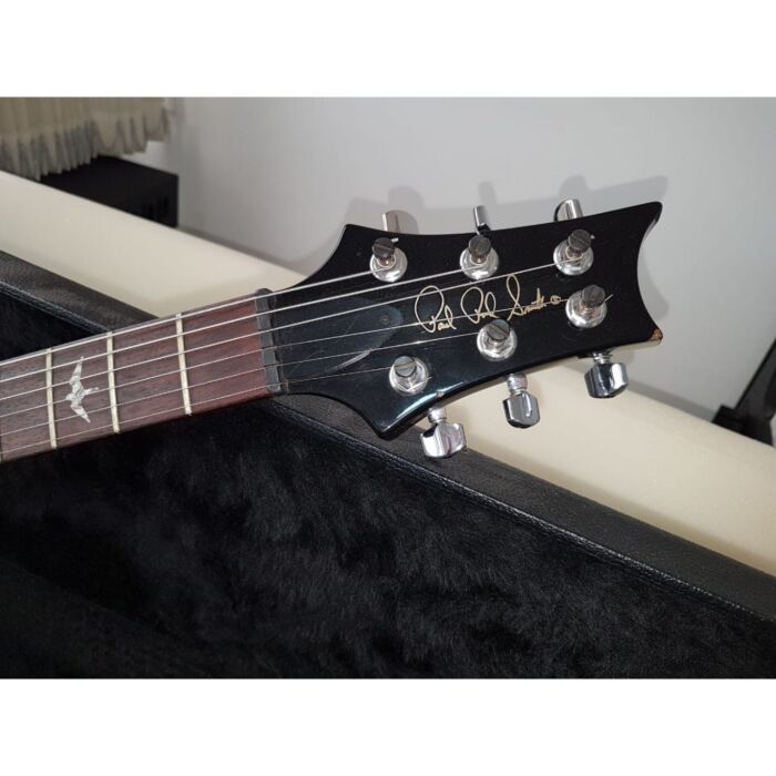 The Al Di Meola Prism features a curly maple custom 9 top with mahogany back, 25 scale length, 22 fret Mexican rosewood fingerboard, custom Al Di Meola neck carve, grommet style locking tuners, standard abalone bird inlays and a tremolo bridge. When discu