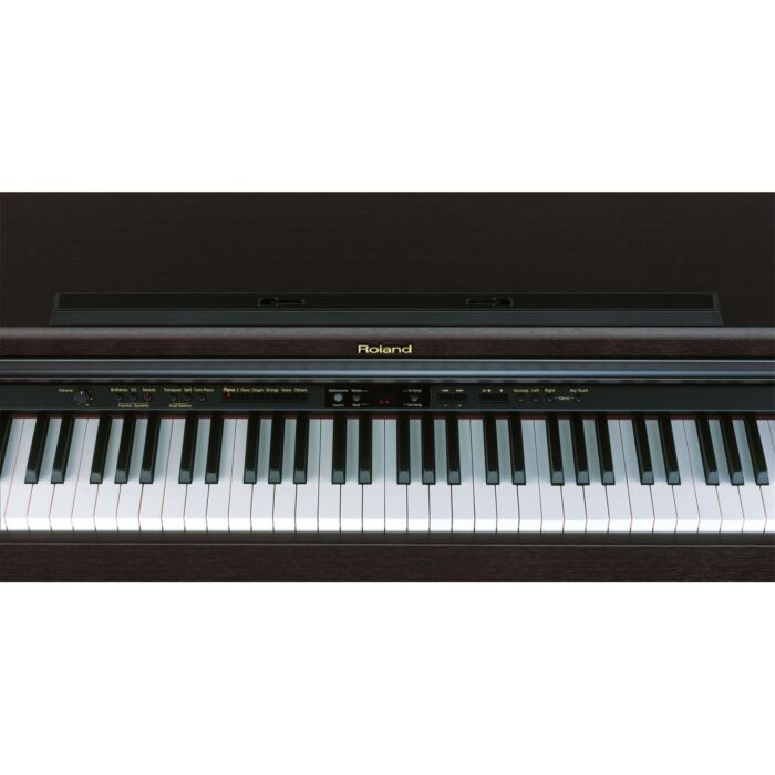 O Roland HP-203 MH é um piano digital de alta qualidade, com teclas sensíveis ao toque e som de piano acústico autêntico. Com um design elegante em mogno escuro, este piano é perfeito para qualquer ambiente de casa ou estúdio. Possui uma variedade de recu O Roland HP-203 MH é um piano digital de alta qualidade, com teclas sensíveis ao toque e som de piano acústico autêntico. Com um design elegante em mogno escuro, este piano é perfeito para qualquer ambiente de casa ou estúdio. Possui uma variedade de recu